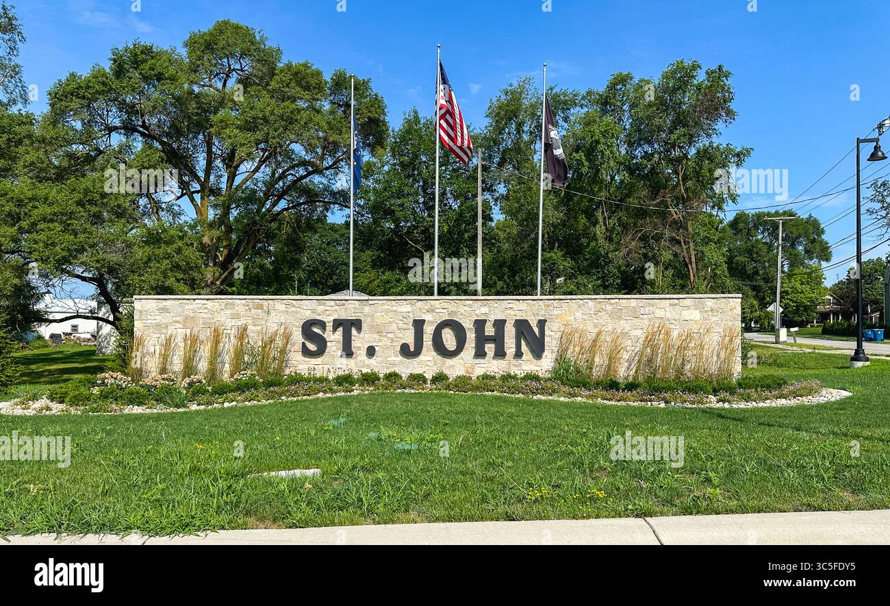 St. John, Indiana sign with flags - Smartphone Captured Stock Image