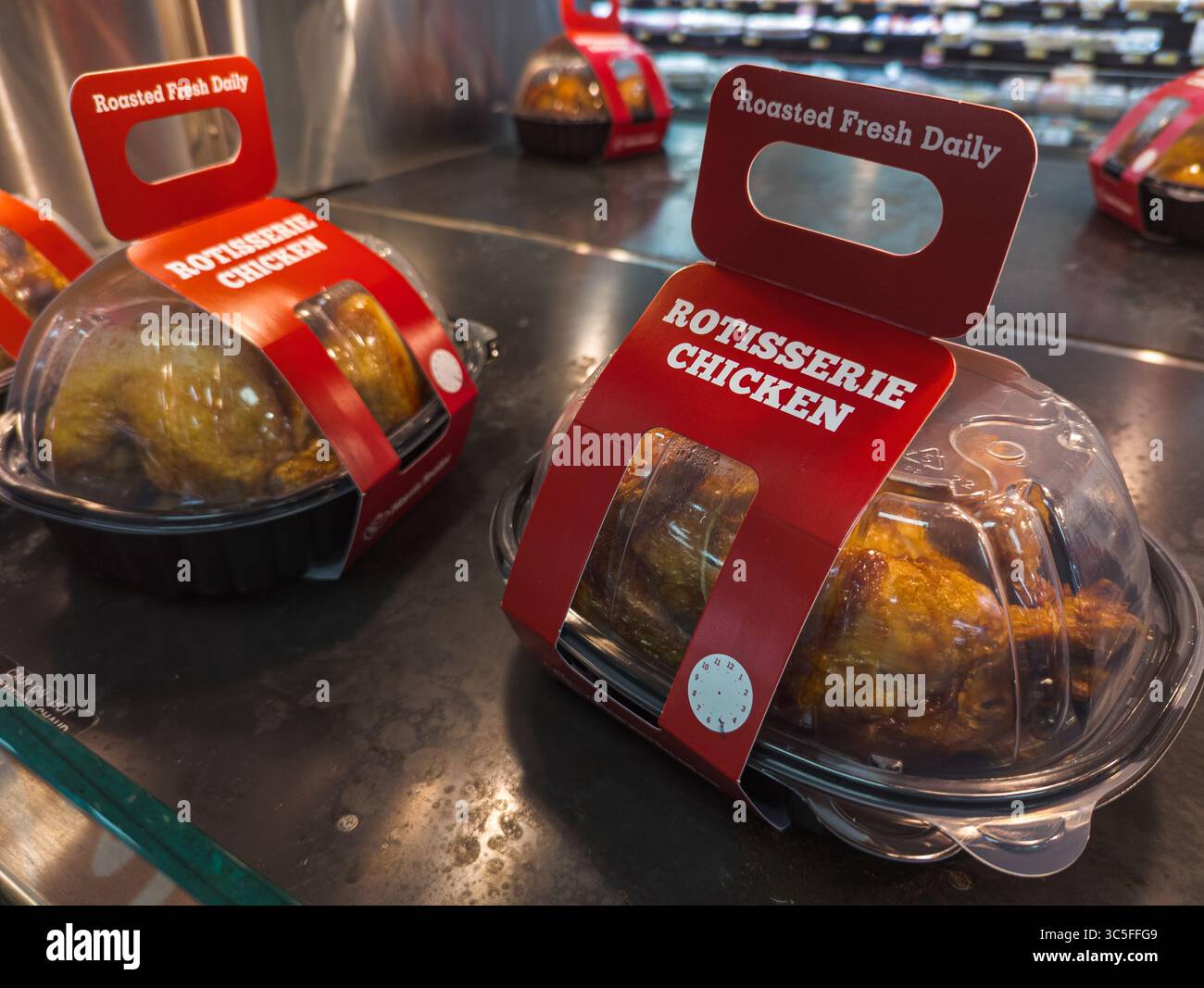 Rotisserie Chicken Packages Warmly Displayed On Heated Shelf At Harris Teeter Deli Section - Smartphone Captured Stock Image