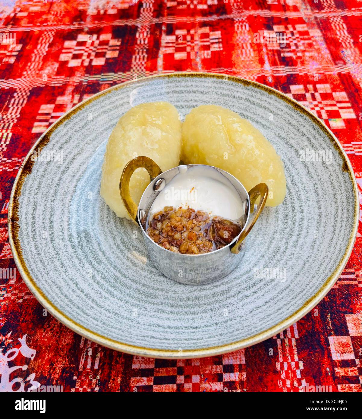 Traditional Lithuanian Cepelinai / Potato dumpling dish. - Smartphone Captured Stock Image