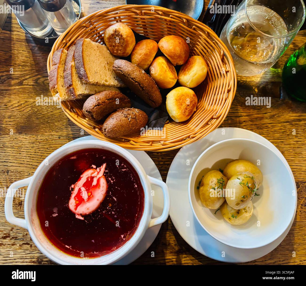 Beetroot Borscht soup with a basket of bread. - Smartphone Captured Stock Image