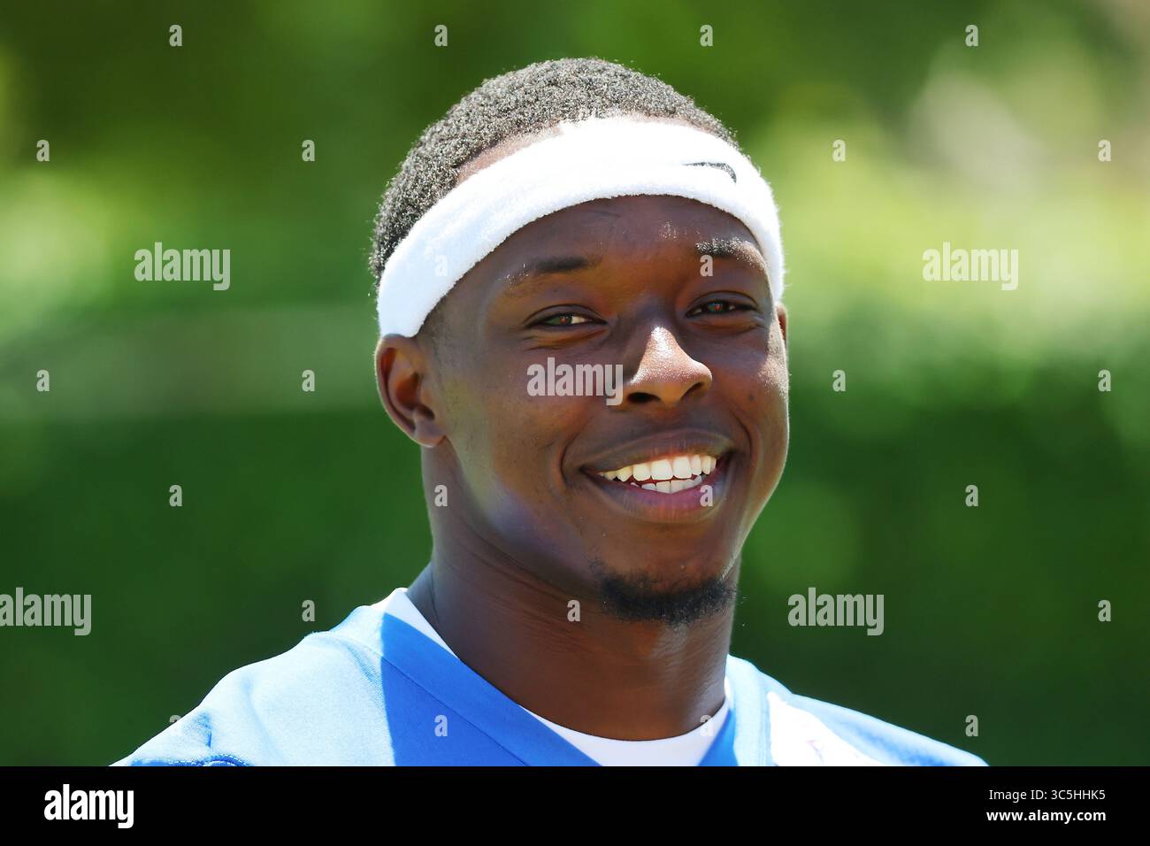 Los Angeles Rams wide receiver Xavier Smith (19) smiles as he watches ...