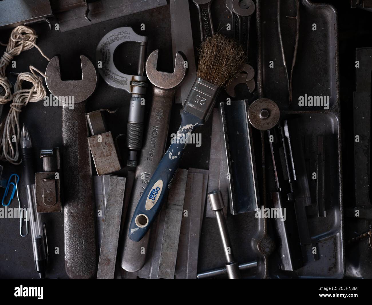 A collection of engineering tools on a bench in a workshop. Stock Photo