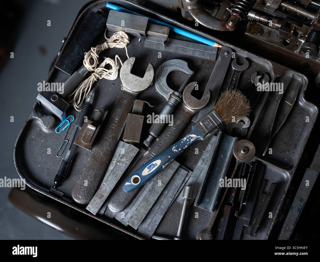 A collection of engineering tools on a bench in a workshop. Stock Photo