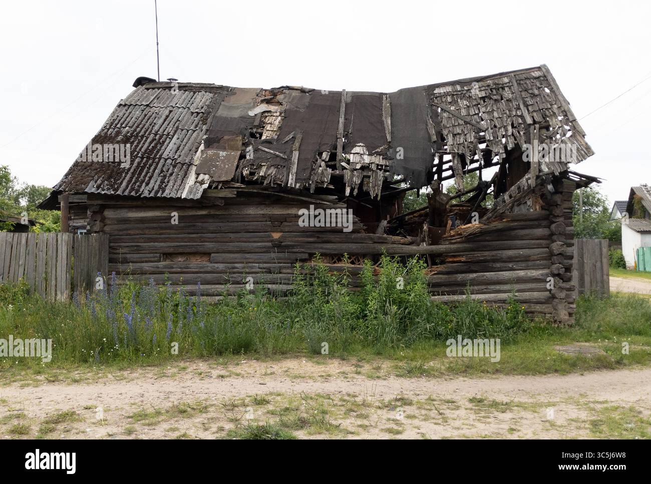 Burnt wooden house, destroyed village house with collapsed roof, empty ...