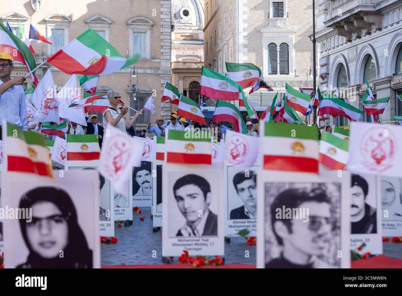 Rome, Italy. 30th July, 2025. Photos of political prisoners killed by the Iranian regime in 1988 are on display in Piazza Santi Apostoli in Rome. Credit: Independent Photo Agency/Alamy Live News Stock Photo