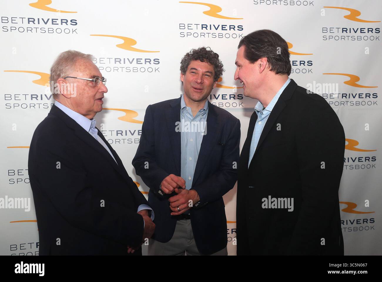 March 9, 2020, Des Plaines, Illinois, USA: Monday, March 9, 2020 - Des Plaines, Illinois, U.S. -  Rush Street Gaming co-founder and Chairman NEIL BLUHM, from left CEO and co-founder of Rush Street Gaming, GREG CARLIN and former Chicago Blackhawks star EDDIE OLCYZK at the opening of the first Illinois sportsbook venue at the Rivers Casino in Des Plaines, Illinois.  Illinois projects to raise between $58 to $102 million a year in annual state tax revenues from sports gambling. (Credit Image: © H. Rick Bamman/ZUMA Wire) Stock Photo