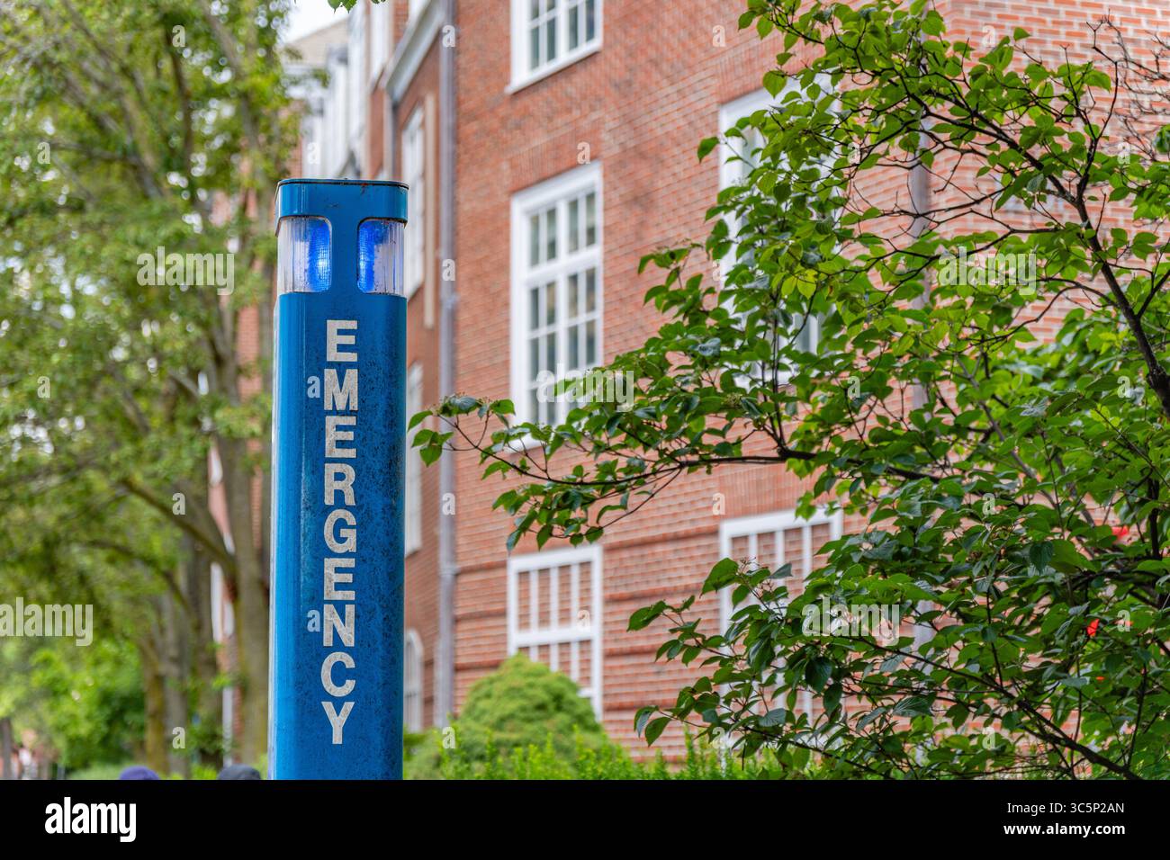 Emergency blue light on college campus. Stock Photo