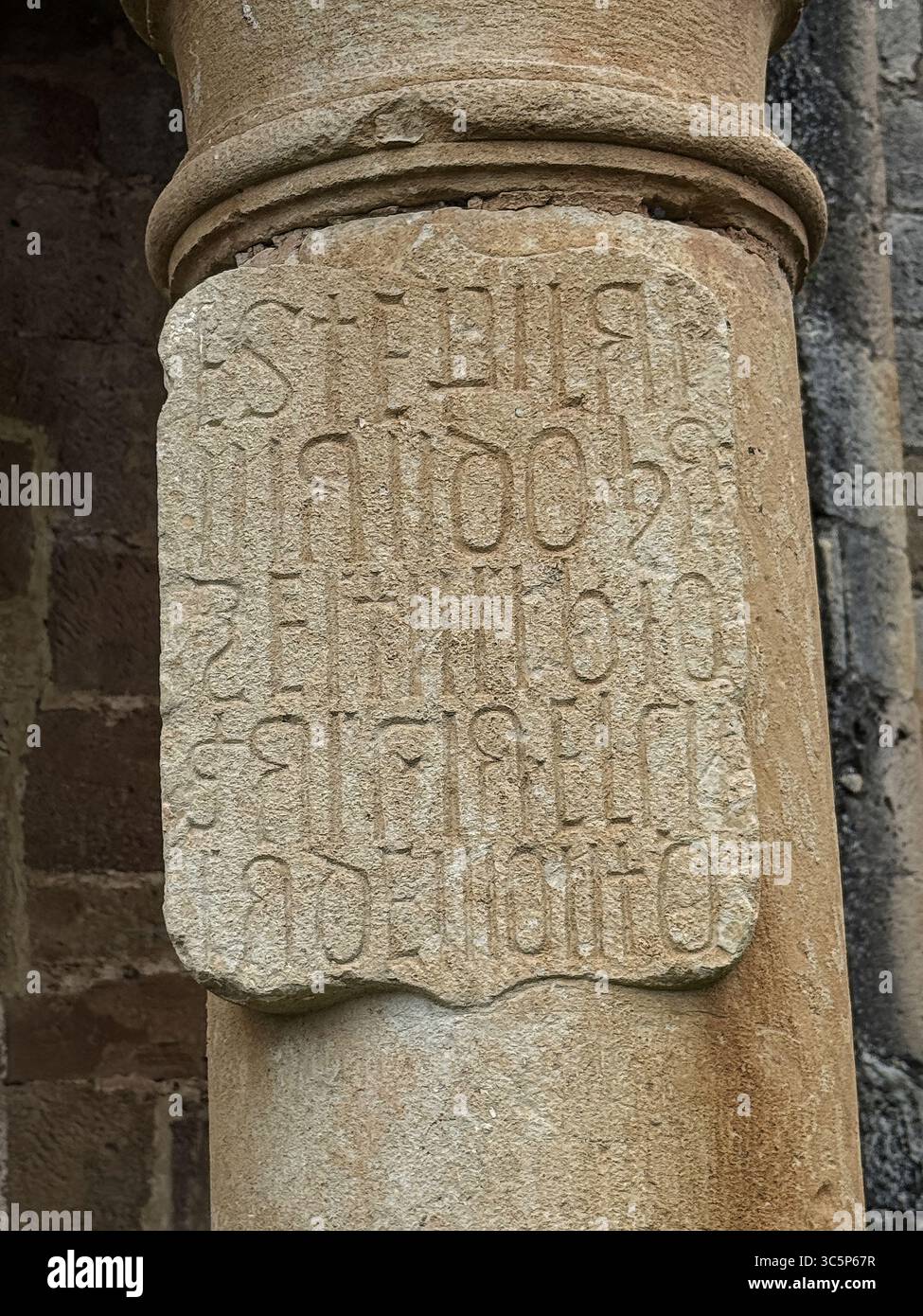 Detail of an ancient stone inscription carved on a cylindrical column ...
