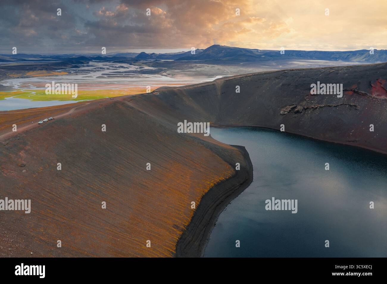 Aerial View of Volcanic Crater Lake and Multicolored Terrain in Iceland Stock Photo