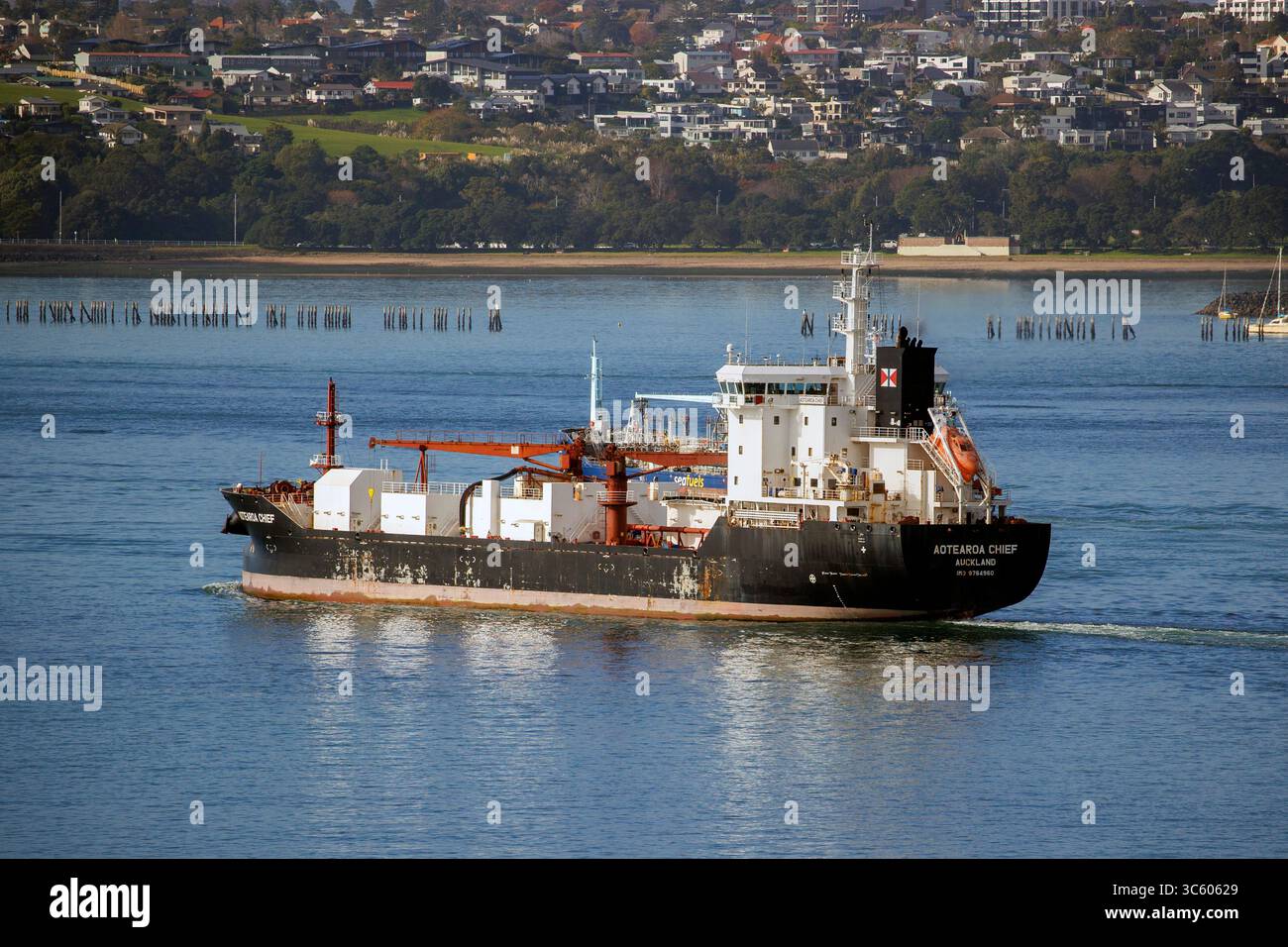 Golden Bay Cement’s bulk cement carrier,  the MV Aotearoa Chief departs from the Ports of Auckland Stock Photo