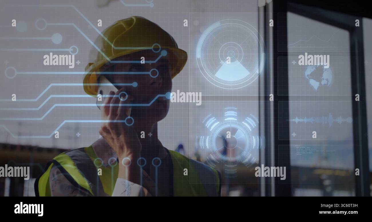 Talking supervisor wearing yellow helmet, vest at building site, holding smartphone with overlays Stock Photo