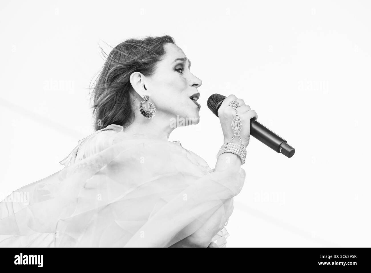 China Forbes performs with Pink Martini band on stage on Rooftop at Pier 17 in New York, NY on July 28, 2025 Stock Photo