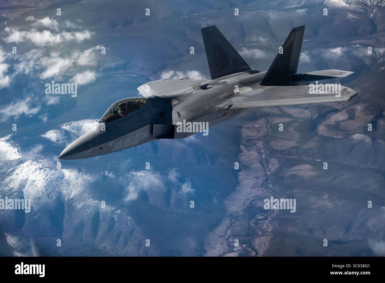 An f 22 raptor flies over kadena air base hi-res stock photography and ...