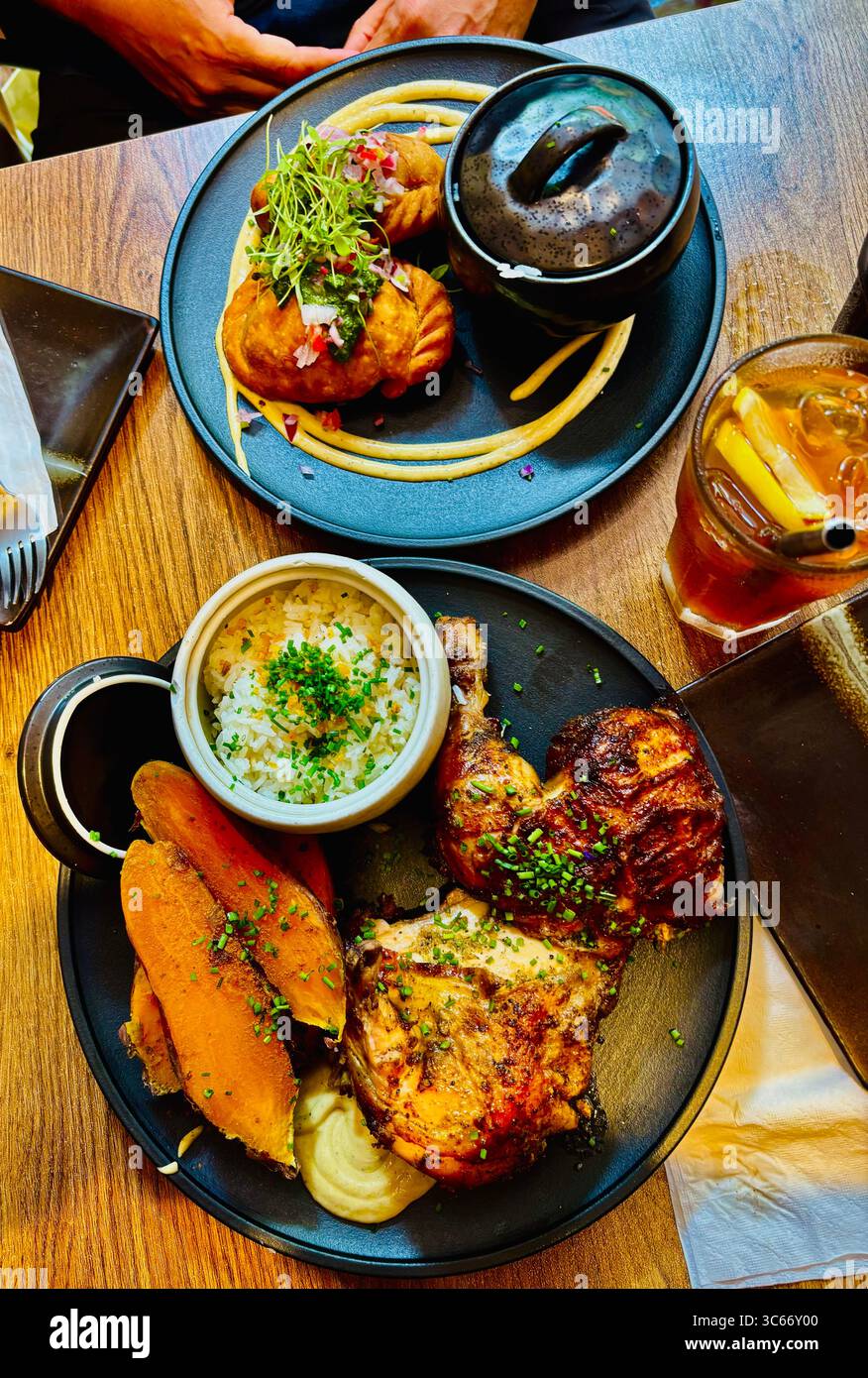 Peruvian Chicken and a plate of Empanandas. - Smartphone Captured Stock Image