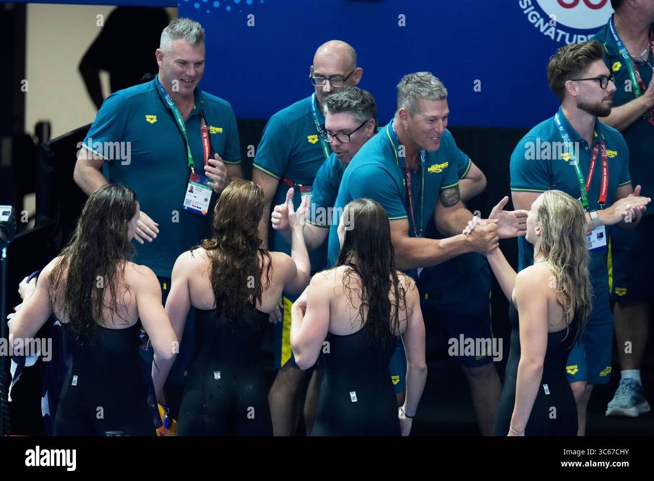 Athletes of team Australia celebrate after winning gold medal in the