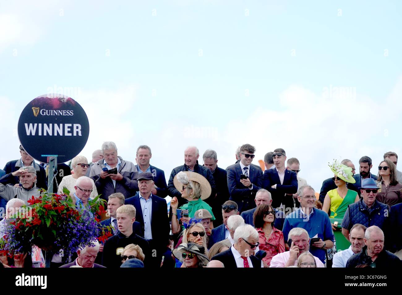 Galway Races Pin Racegoers ahead of the day's racing at Galway Racecourse in Galway ...