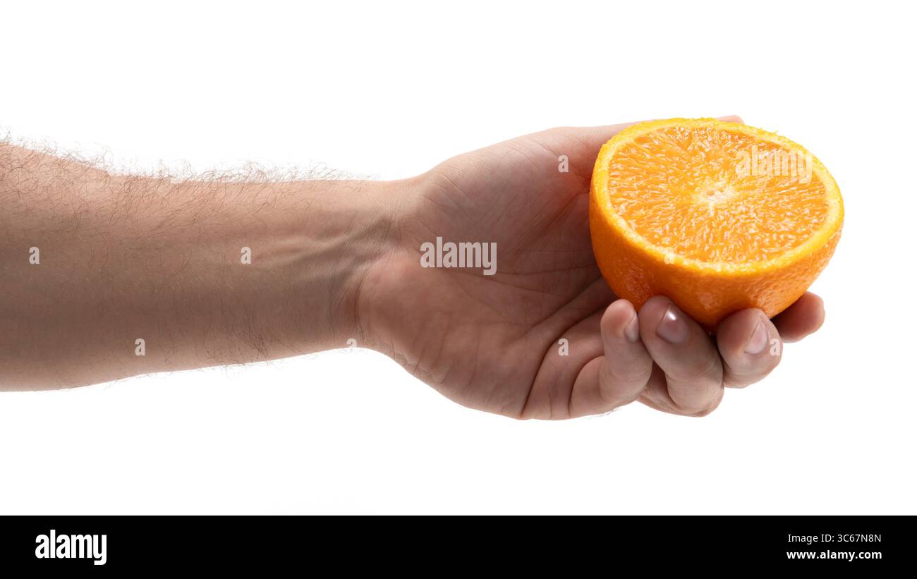Hand holding half orange hi-res stock photography and images - Alamy