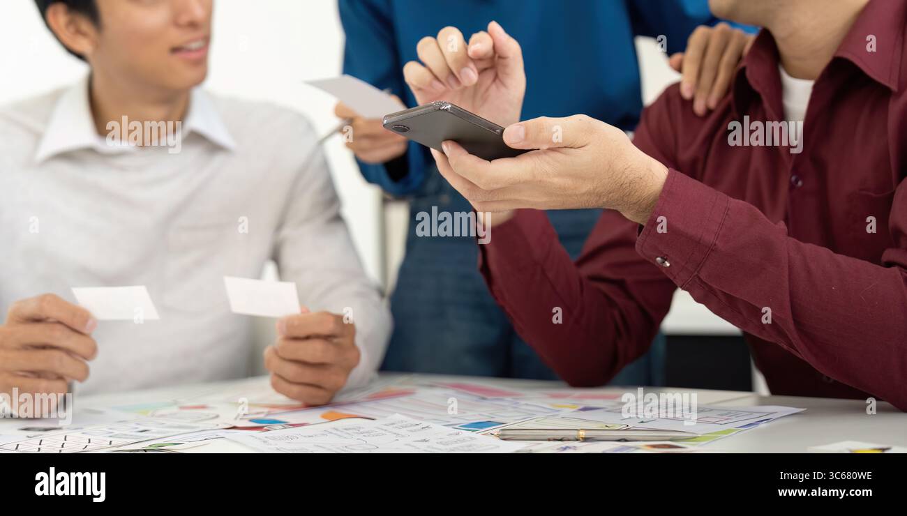 UX and UI Team Discussing Design Ideas with Smartphone Stock Photo - Alamy