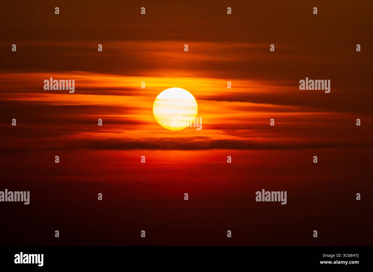 Dramatic sunset sky with red and orange hues, phase III Stock Photo