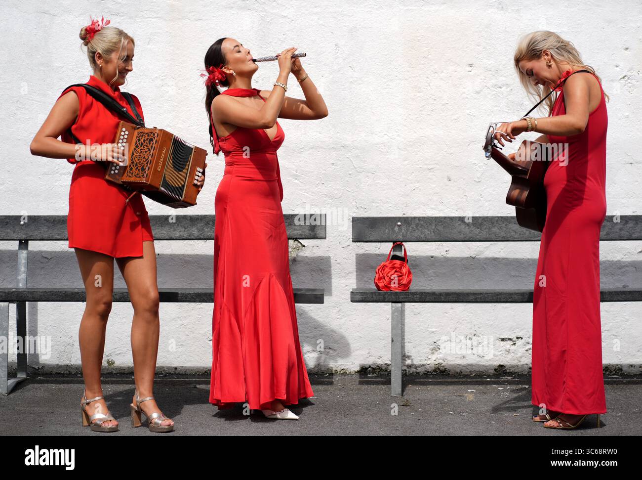 Eibhlin, Katie, and Laura of Cailini Lua perform at Galway Racecourse ...