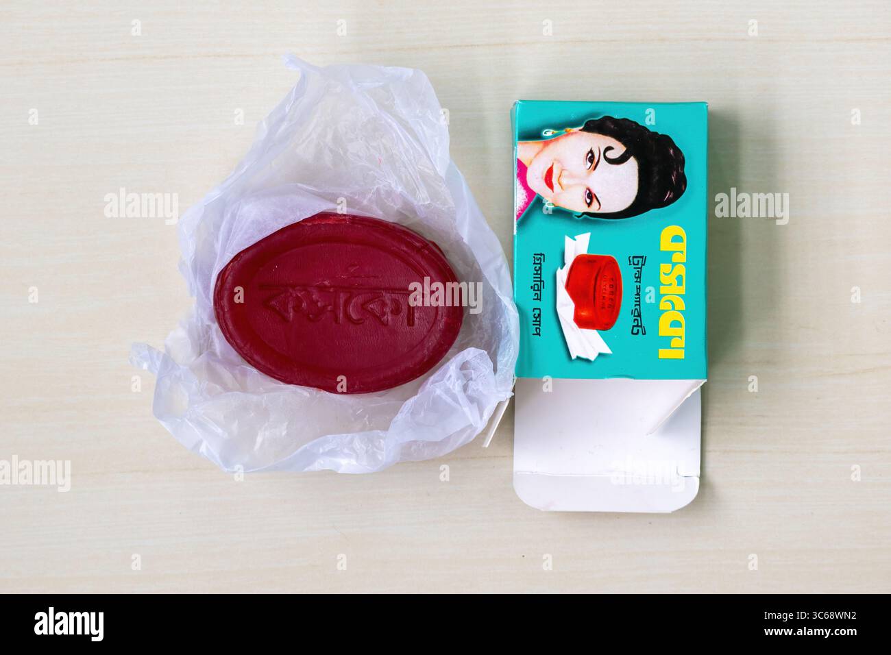Cosco Transparent Glycerin Soap and packet, placed on wooden background.  Top view. Kishoreganj, Bangladesh. 04 November, 2024 Stock Photo - Alamy
