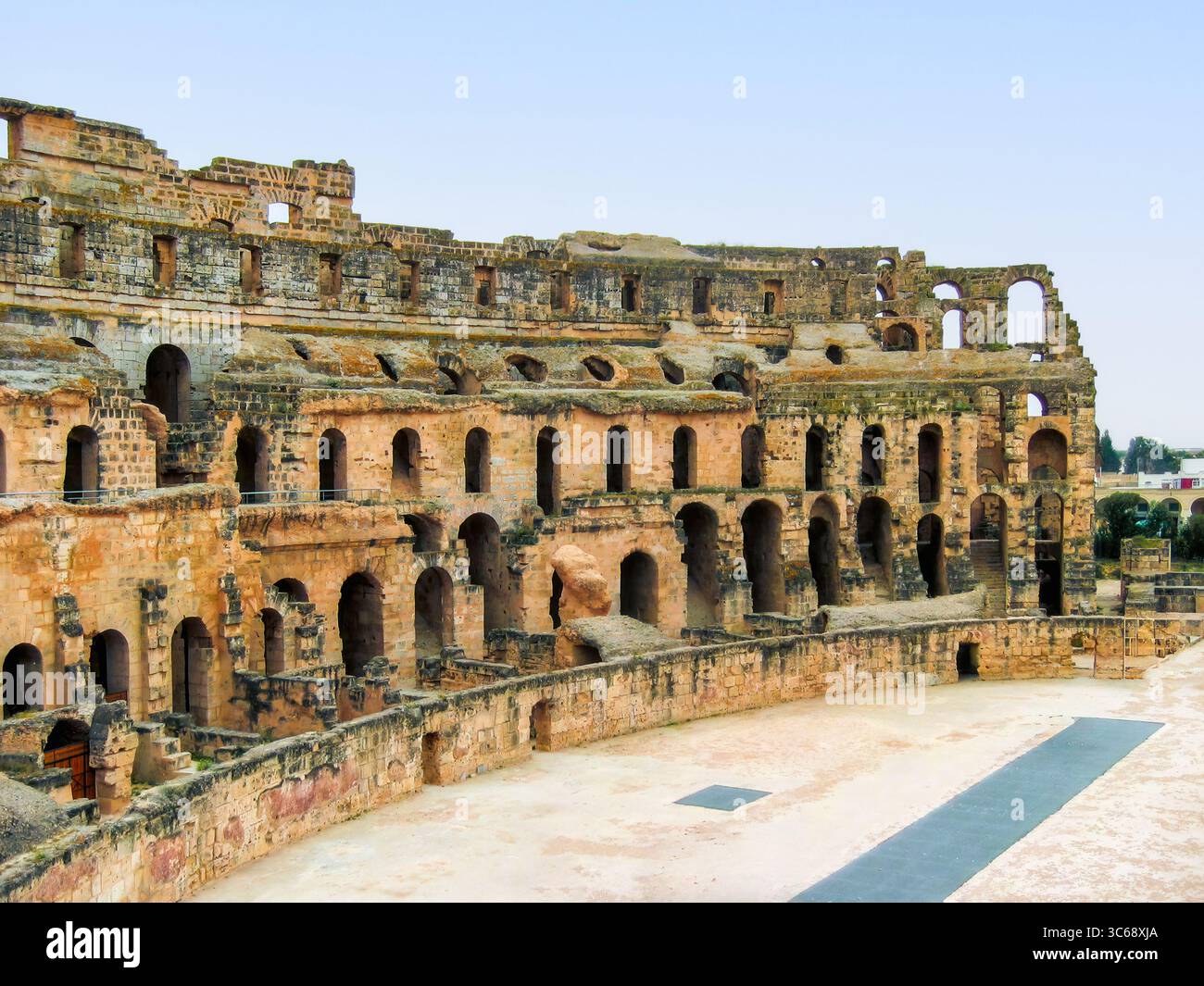 Ancient Roman amphitheatre features grand stone structure with arched ...