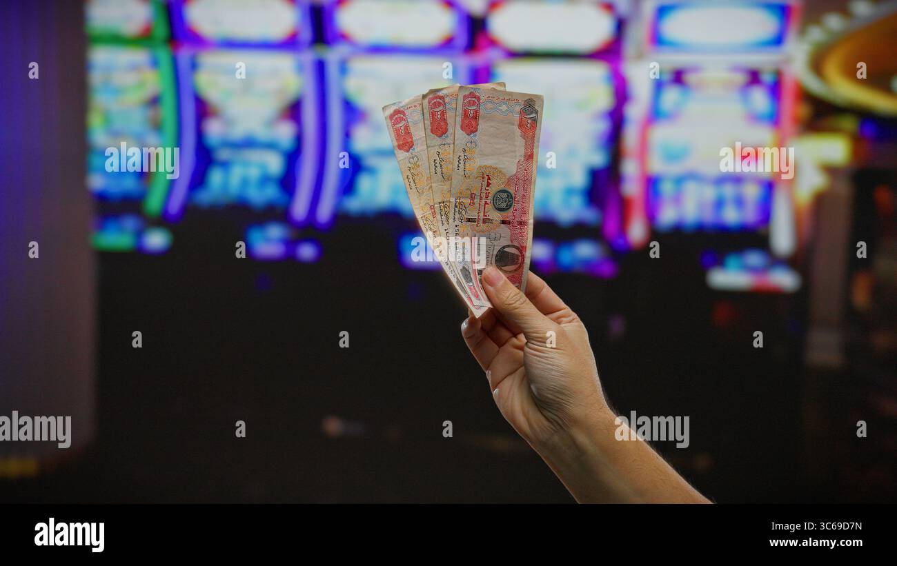Hand holding dirham banknotes hi-res stock photography and images - Alamy
