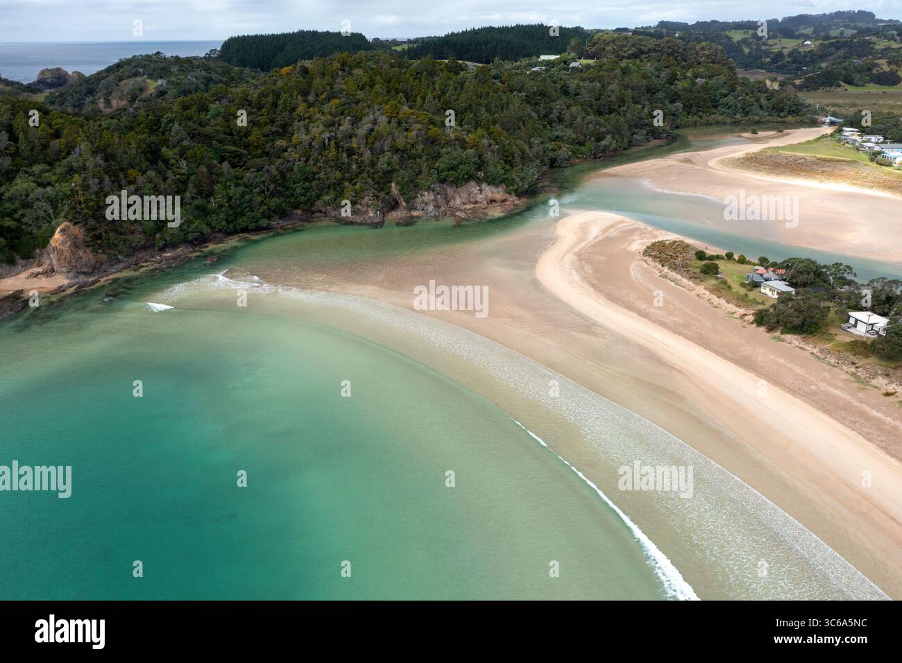 Aerial view of the river mouth meeting the ocean's turquoise waters ...