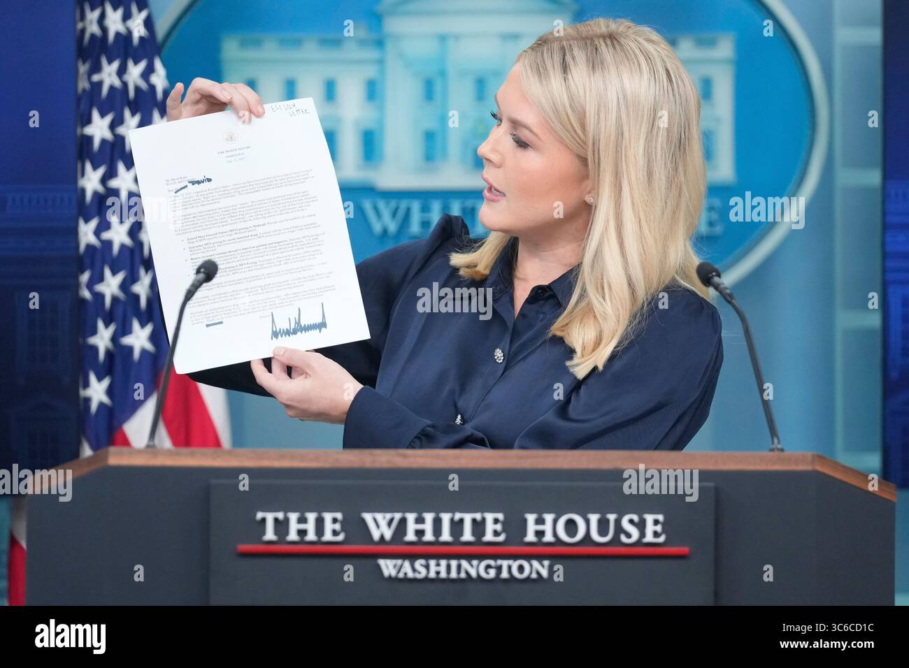 White House press secretary Karoline Leavitt holds up a letter from ...