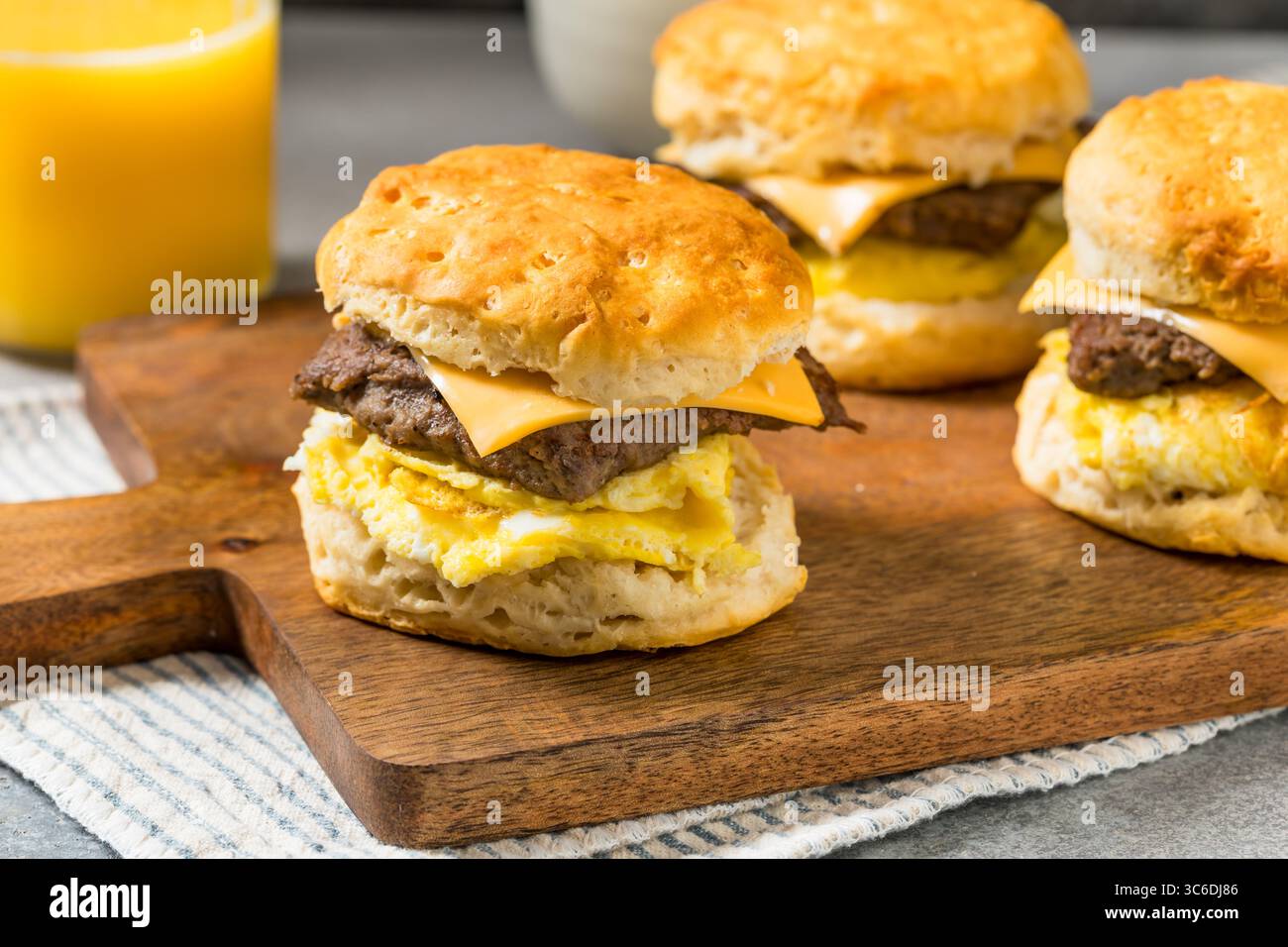 Homemade Sausage Egg Biscuit Breakfast Sandwich with Cheese Stock Photo