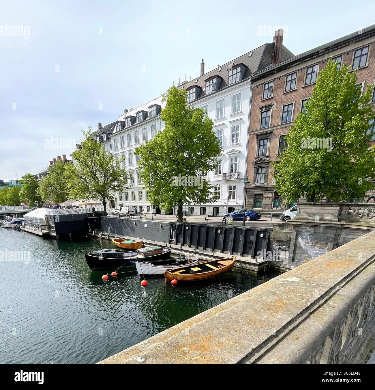 View of city buildings along the canal in Copenhagen, Denmark. - Smartphone Captured Stock Image
