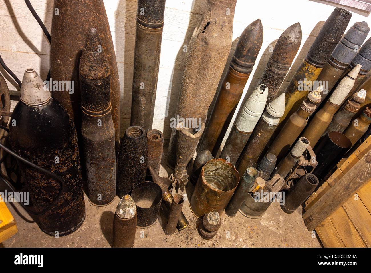 Collection of rusty vintage artillery shells and military ordinance in ...