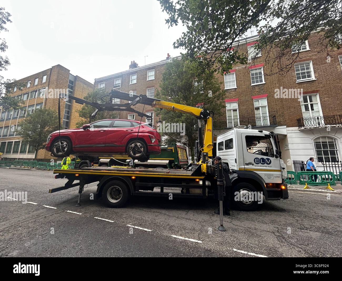 Road re-surfacing in a residential street in Marylebone, London W1 UK Stock Photo