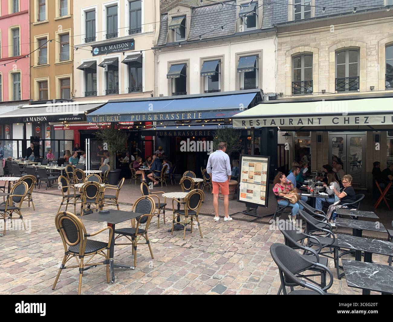 Boulogne Sur Mer France shop shops restaurant Restaurants Town place living street home Church eating outside out warm Sunny food place - Smartphone Captured Stock Image
