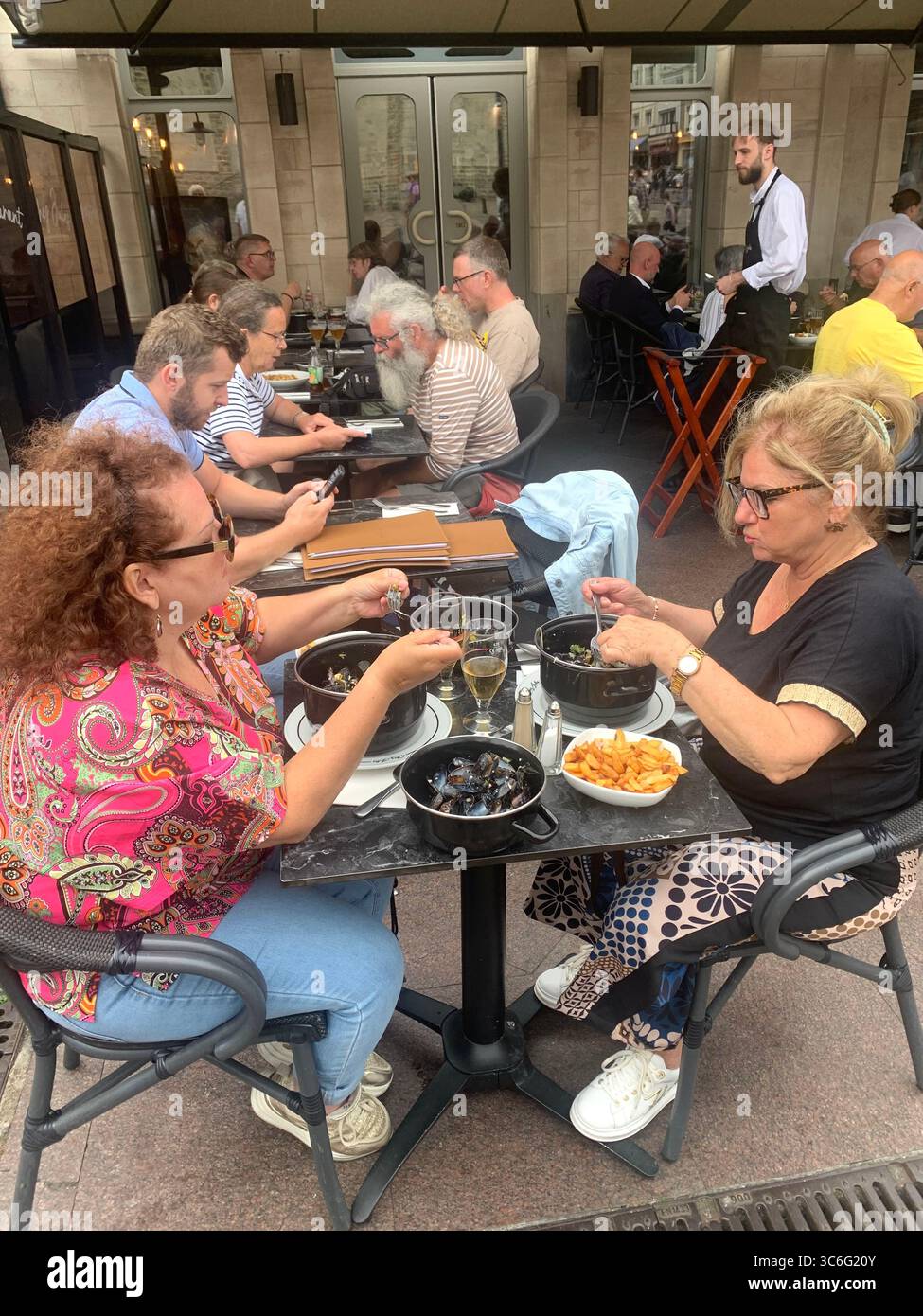 Boulogne Sur Mer France shop shops restaurant Restaurants Town place living street home Church eating outside out warm Sunny food place - Smartphone Captured Stock Image