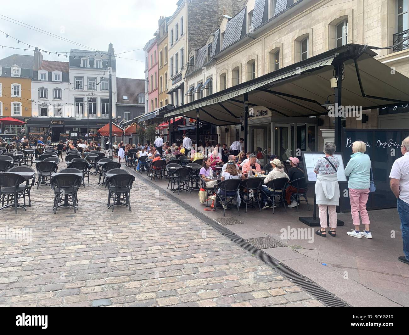 Boulogne Sur Mer France shop shops restaurant Restaurants Town place living street home Church eating outside out warm Sunny food place - Smartphone Captured Stock Image
