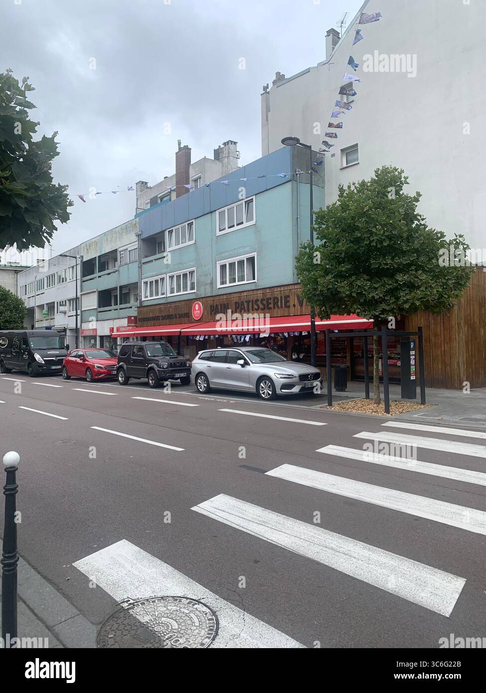 Boulogne Sur Mer France shop shops restaurant Restaurants Town place living street home Church eating outside out warm Sunny food place - Smartphone Captured Stock Image