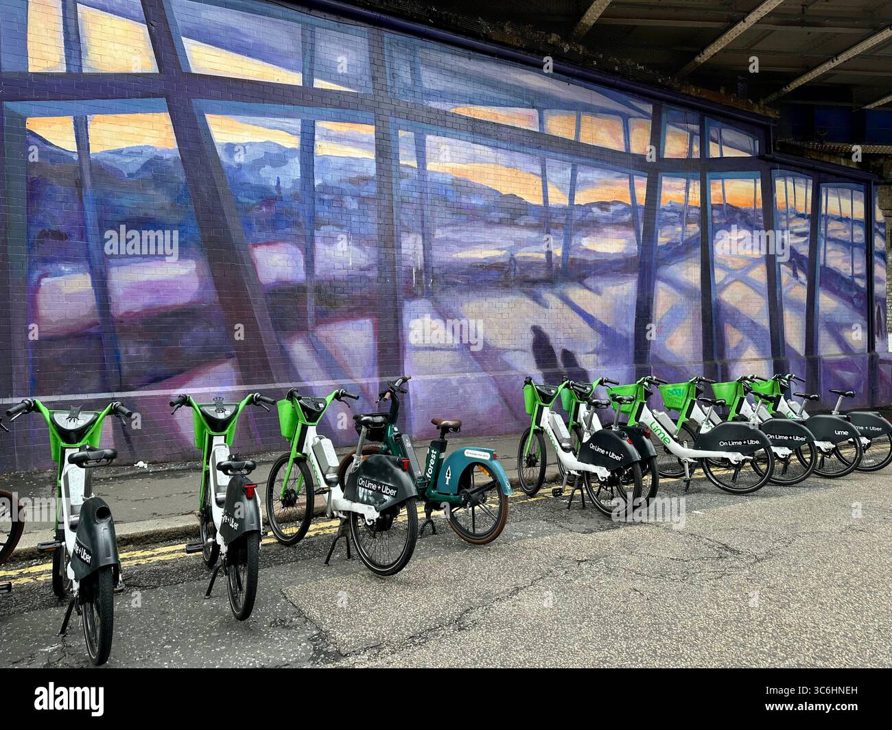 Lime bikes for rent in Sandell Street close to Waterloo station, London, UK - Smartphone Captured Stock Image