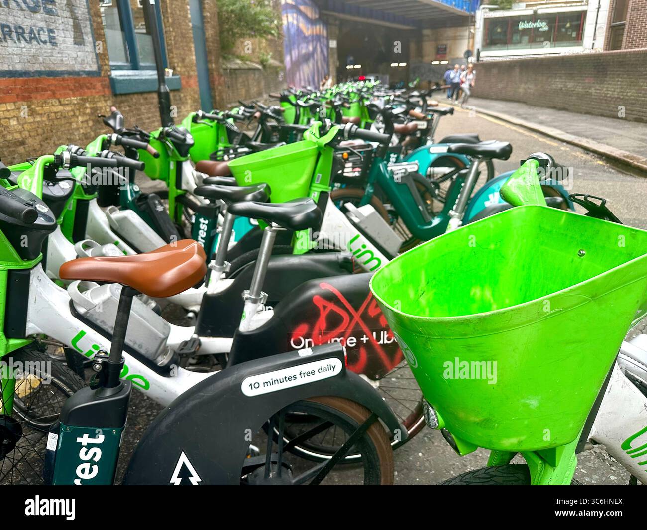 Lime bikes for rent in Sandell Street close to Waterloo station, London, UK - Smartphone Captured Stock Image