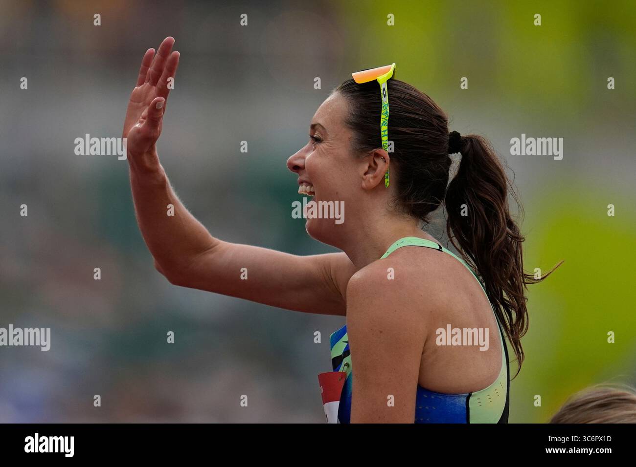 Emily Infeld reacts after winning the women's 10,000-meter final at the ...