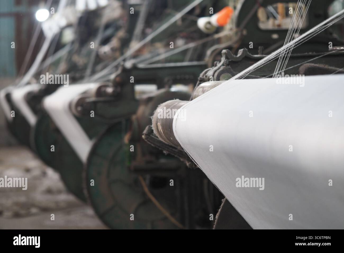 Machines operate in a textile factory during work hours Stock Photo - Alamy