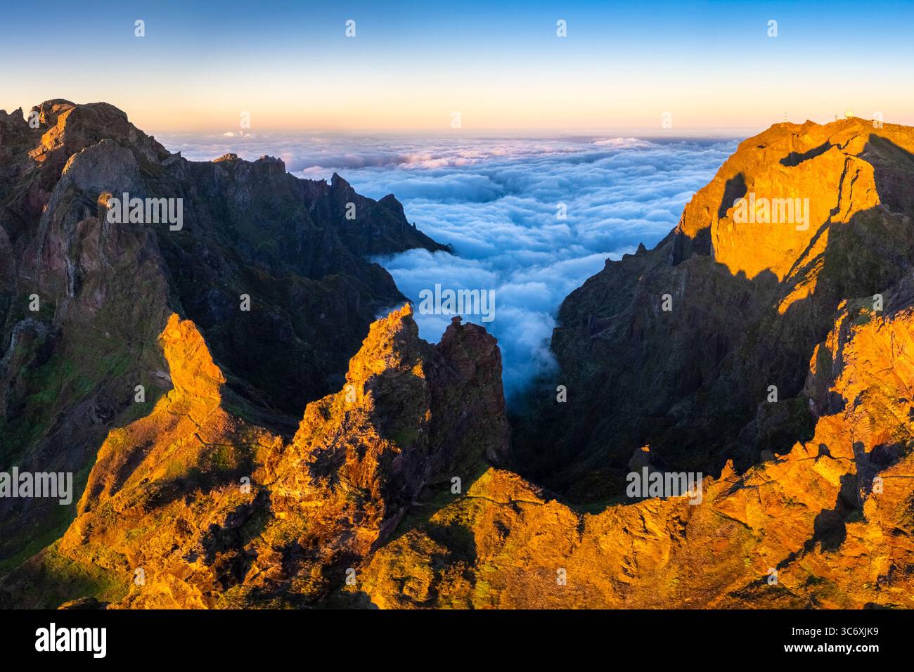 Aerial view of the mountains and trails leading to Pico Pico do Arieiro during a spring sunset. Madeira island, Portugal. Stock Photo