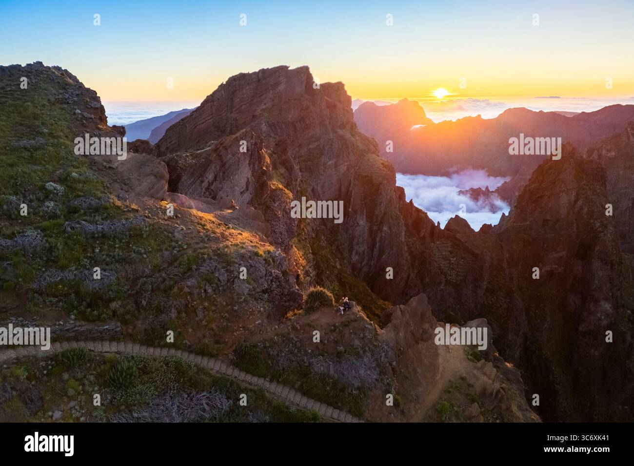Aerial view of the mountains and trails leading to Pico Pico do Arieiro during a spring sunset. Madeira island, Portugal. Stock Photo