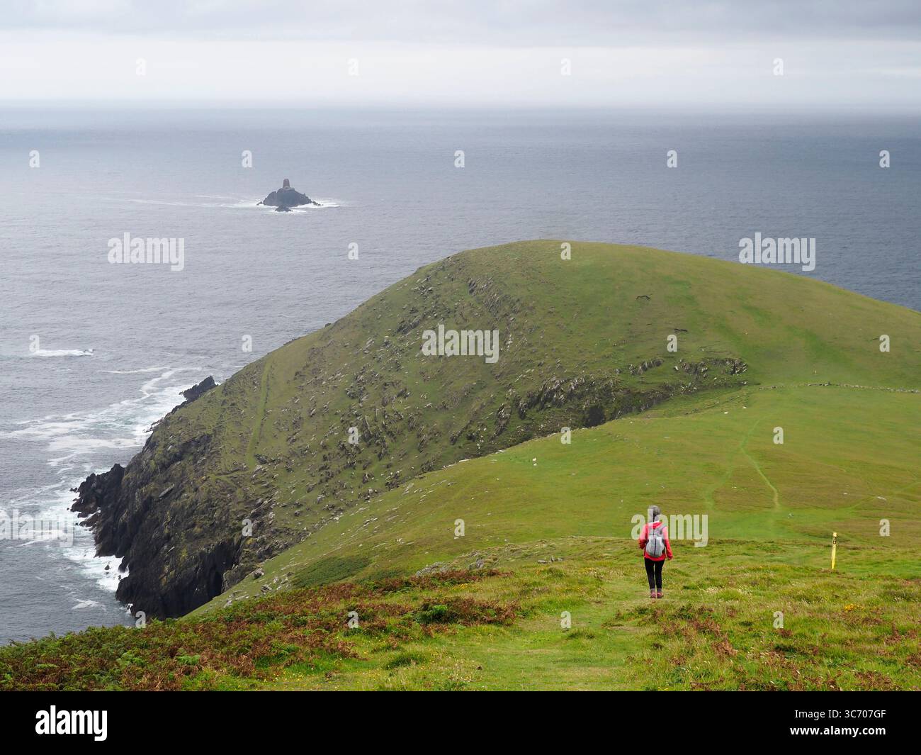 Walker on west end of Dursey island, Beara peninsula, Ireland Stock Photo