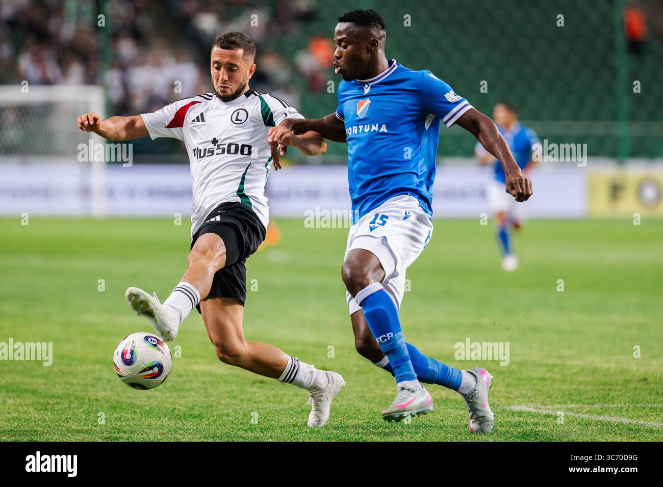 Wahan Biczachczian (Vahan Bichakhchyan) (L) of Legia and Patrick Kpozo ...