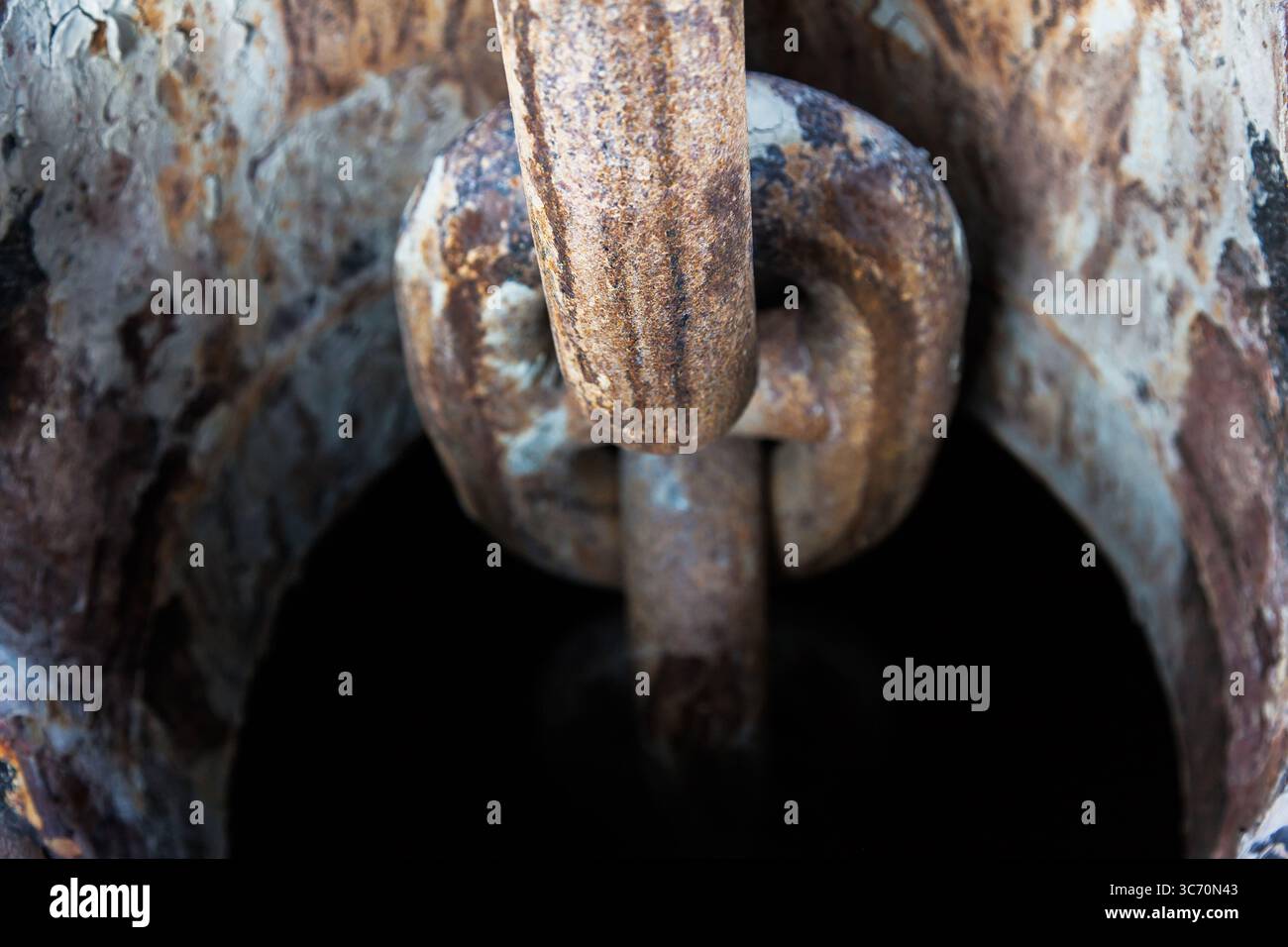 Rusty anchor chain on a ship close-up. Stock Photo