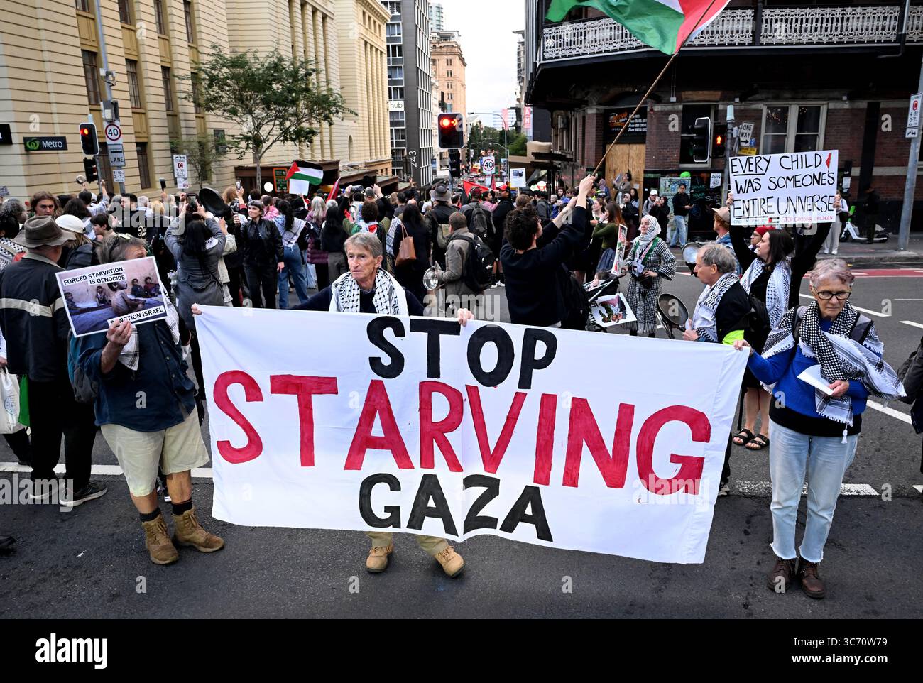 Protesters are seen during a Justice for Palestine rally in Brisbane ...