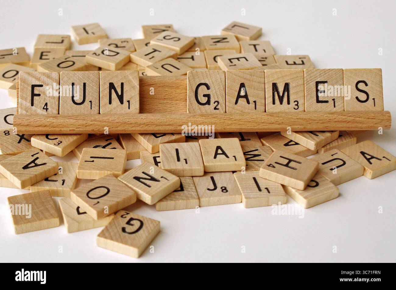 Close up of vintage wooden Scrabble game tiles showing different ...