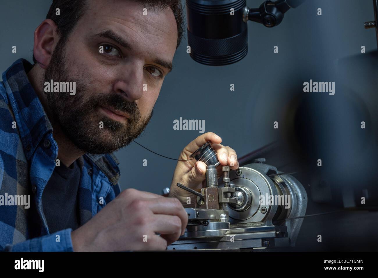 Raul Pagès, Swiss independent watchmaker, working in his atelier, showcasing traditional craftsmanship and mechanical precision in high-end horology. Stock Photo