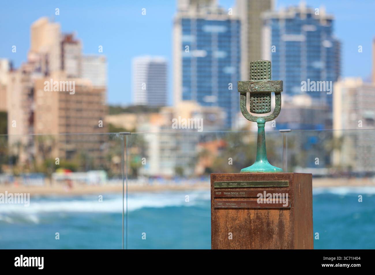 BENIDORM, SPAIN - APRIL 9, 2025: Microphone monument commemorating Benidorm Fest song contest in Benidorm, Spain. Stock Photo